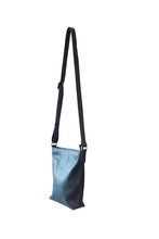 Load image into Gallery viewer, Side view of deep blue, buttery soft, cow leather crossbody bag. Silver zip and buckles. 