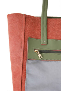 Inside zipped pocket of Hoopla leather olive green tote. 
