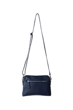 Load image into Gallery viewer, Back view of a navy leather crossbody bag. With fully adjustable strap and silver zips, Hoopla brand. 