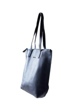 Load image into Gallery viewer, Side view of buttery navy soft pebbled leather Hoopla tote bag with a gold coloured zip. 