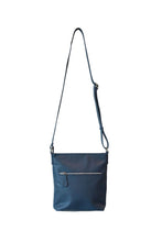 Load image into Gallery viewer, Back view of deep blue, buttery soft, cow leather crossbody bag with external silver chunky zip. 
