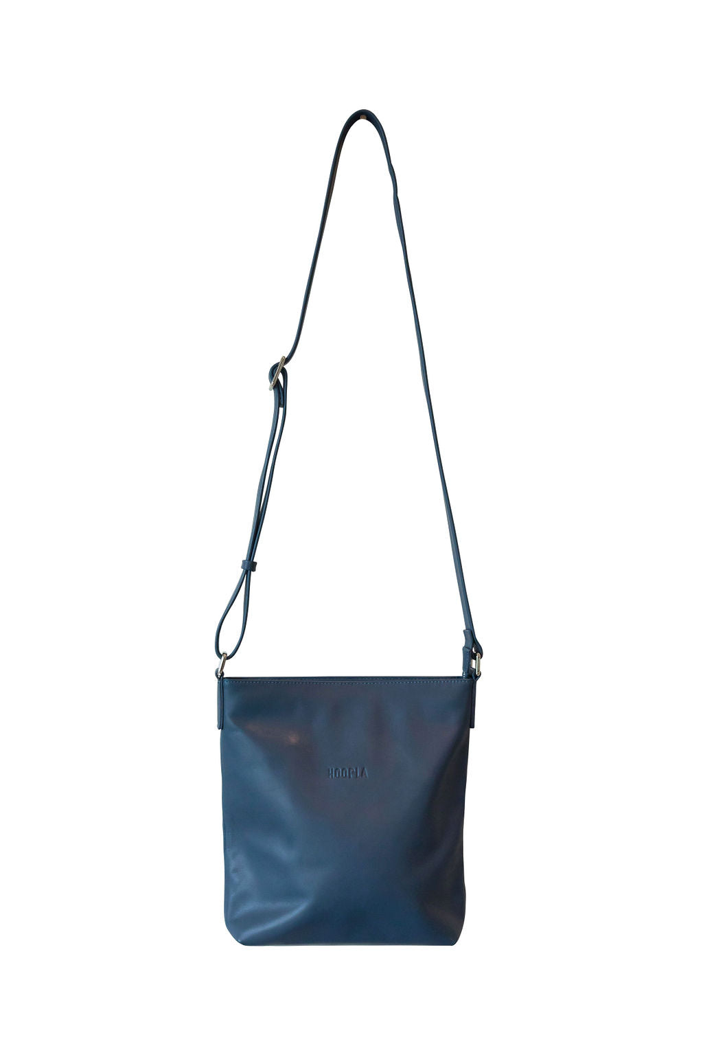 Front view of deep blue, buttery soft, cow leather crossbody bag. Silver zip and buckles. 