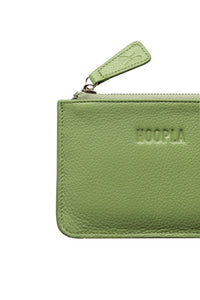 Detail of small coin and card pebbled leather bright green Hoopla purse. With silver zip and leather zip tag. 