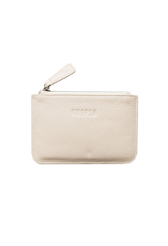 Front view of small coin and card pebbled leather cream Hoopla purse. With silver zip and leather zip tag. 