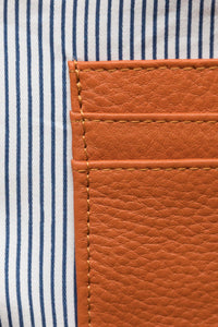 Close up of internal credit card pockets in ochre pebbled leather Hoopla coin and card purse