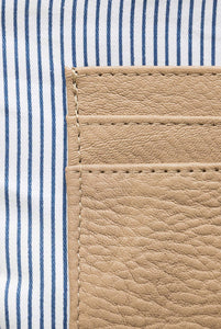 Close up of internal credit card pockets in tan pebbled leather Hoopla coin and card purse
