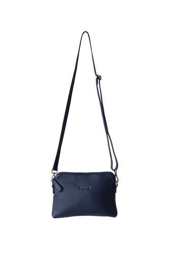 Front view of a navy leather crossbody bag. With fully adjustable strap and silver zips, Hoopla brand. 