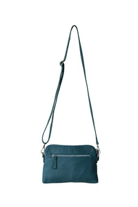 Back view of a teal leather crossbody bag. With fully adjustable strap and silver zips, Hoopla brand. 