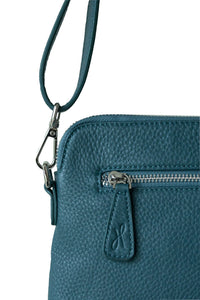 Back silver zip on teal leather crossbody bag with Hoopla zip tag. 