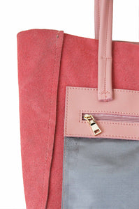 Inside zipped pocket of Hoopla leather dusty pink tote. 