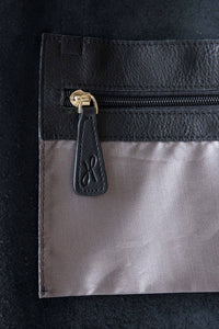 Internal pocket with gold zip for the buttery soft pebbled leather black tote with zip from Hoopla. 