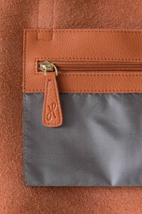 Internal pocket with gold zip for the buttery soft pebbled leather ochre tote with zip from Hoopla. 