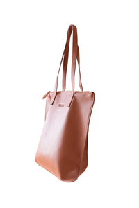 Side view of buttery ochre soft pebbled leather Hoopla tote bag with a gold coloured zip. 