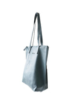 Load image into Gallery viewer, Side view of buttery teal soft pebbled leather Hoopla tote bag with a gold coloured zip. 