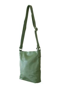 Side view of forest green, buttery soft, cow leather crossbody bag. Silver zip and buckles. 